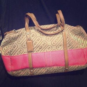 Coach bag — hot pink and tan.